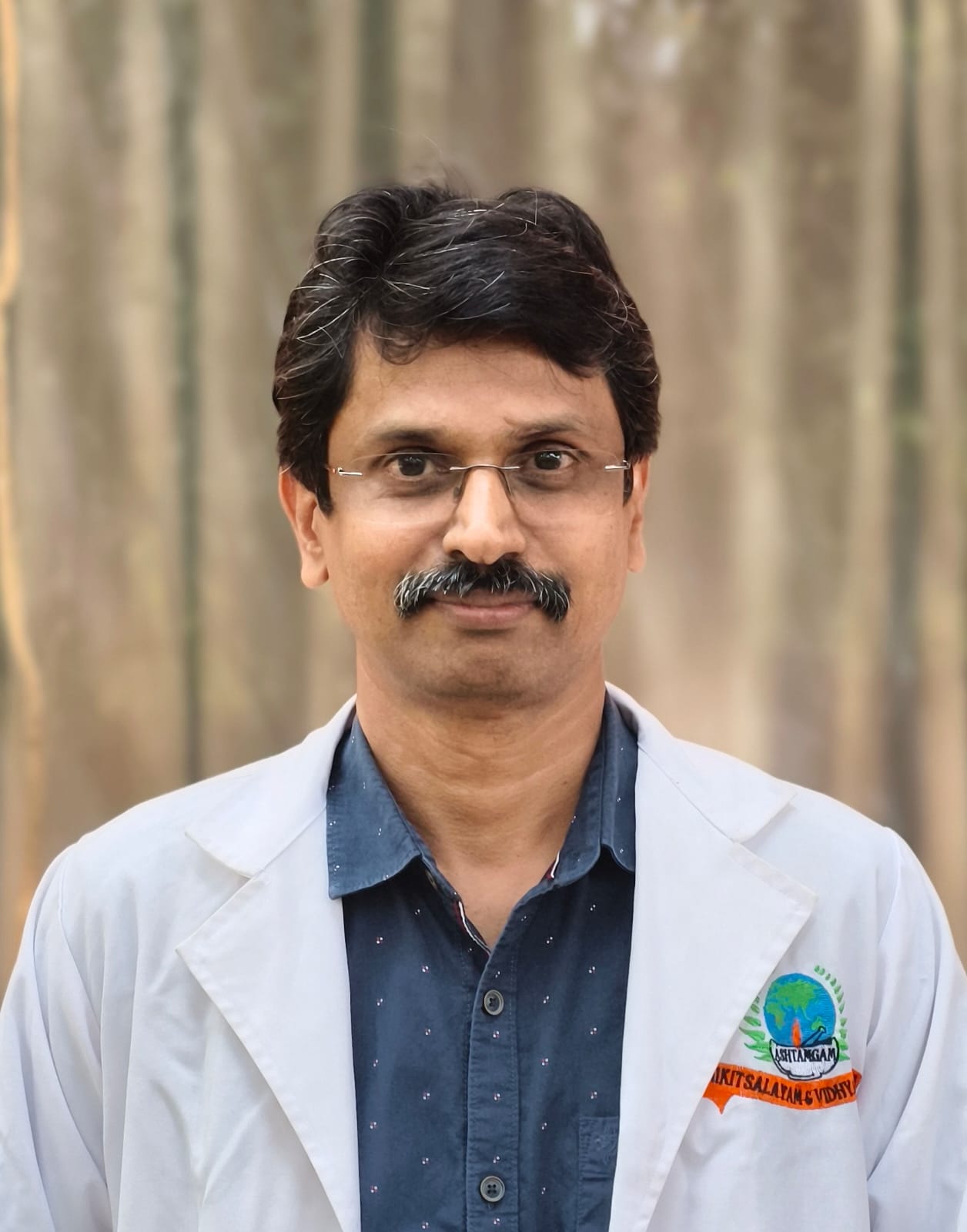 Dr. Manoj Kumar K - Ashtamgam Ayurveda Chikitsalayam